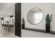 Stylish entryway featuring a decorative mirror, plants, and modern design elements at 3955 Lana Ave, Davenport, FL 33897