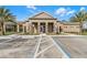 Beautiful clubhouse exterior featuring stone accents, a covered entryway, and accessible parking at 314 Rover Rd, Ormond Beach, FL 32174