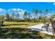 Outdoor dog park featuring green space, bench seating, and a pet waste station at 314 Rover Rd, Ormond Beach, FL 32174