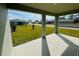 Covered patio with a view of the manicured lawn and neighborhood at 314 Rover Rd, Ormond Beach, FL 32174