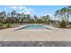 Large community pool surrounded by lounge chairs and manicured landscaping, ideal for recreation and relaxation at 314 Rover Rd, Ormond Beach, FL 32174