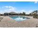 Community pool area with a clubhouse and lounge chairs, perfect for relaxation and social gatherings at 314 Rover Rd, Ormond Beach, FL 32174