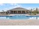 Resort-style pool with a spacious clubhouse and comfortable lounge seating for relaxing poolside at 314 Rover Rd, Ormond Beach, FL 32174