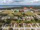 Aerial view of property with nearby shopping and Lake Minneola in the background at 721 Willow Run St, Minneola, FL 34715
