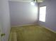 Bedroom with purple walls, ceiling fan, and natural light from the window at 721 Willow Run St, Minneola, FL 34715