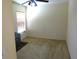 Bedroom with neutral walls, ceiling fan, and natural light from the window at 721 Willow Run St, Minneola, FL 34715