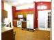 Eat in Kitchen featuring laminate flooring, wooden cabinetry and stainless steel appliances at 721 Willow Run St, Minneola, FL 34715