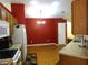 Eat in Kitchen featuring laminate flooring, wooden cabinetry and stainless steel appliances at 721 Willow Run St, Minneola, FL 34715