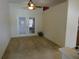 View of living room featuring double glass doors that lead to a patio at 721 Willow Run St, Minneola, FL 34715