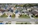 Aerial view of a house with solar panels and a fenced backyard at 356 Nova Dr, Davenport, FL 33837