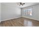 Bedroom with wood-look floors, ceiling fan and window at 356 Nova Dr, Davenport, FL 33837