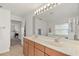 Double vanity bathroom with a large mirror and a soaking tub at 36711 Alaqua Ct, Eustis, FL 32736