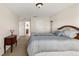 Cozy bedroom with carpeted floors, a queen-sized bed, and ample closet space at 36711 Alaqua Ct, Eustis, FL 32736
