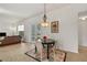 Casual breakfast nook with a round table and four chairs, near the kitchen at 36711 Alaqua Ct, Eustis, FL 32736