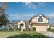 Two-story house with a large yard, attached garage, and attractive landscaping at 36711 Alaqua Ct, Eustis, FL 32736