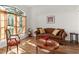 Cozy sitting room featuring wood floors, a decorative window, and stylish furniture at 36711 Alaqua Ct, Eustis, FL 32736
