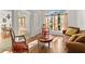 Bright living area with hardwood floors, a window, and a cozy sofa at 36711 Alaqua Ct, Eustis, FL 32736