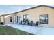 Back patio with seating; perfect for outdoor relaxation at 36711 Alaqua Ct, Eustis, FL 32736