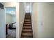 Carpeted staircase leading to the second floor at 36711 Alaqua Ct, Eustis, FL 32736