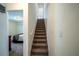 Carpeted stairs leading upstairs, adjacent to a bedroom at 36711 Alaqua Ct, Eustis, FL 32736