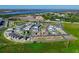 Aerial view of a new home community near a body of water, showing various stages of construction at 438 Belmond Dr, Debary, FL 32713