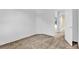 Empty bedroom with carpeted floor and view to hallway and outside at 4538 Nottoway Dr, Leesburg, FL 34748