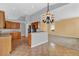 Open kitchen layout with breakfast bar and seamless flow to living areas at 4538 Nottoway Dr, Leesburg, FL 34748
