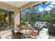 Screened patio with outdoor furniture, perfect for relaxation and entertaining guests at 4538 Nottoway Dr, Leesburg, FL 34748