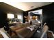 Dining room with black walls, wooden table, table settings, and lamps on console table at 4916 Fiji Cir # 11, Orlando, FL 32808