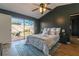 Main bedroom with dark accent wall and sliding glass door to the outdoor patio at 4916 Fiji Cir # 11, Orlando, FL 32808