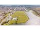 Expansive aerial view of neighborhood featuring community pool, playground, lake, and green spaces at 1518 Alligator St, St Cloud, FL 34771