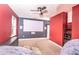 Bedroom features a large screen and projector setup, as well as a ceiling fan at 1518 Alligator St, St Cloud, FL 34771