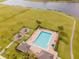 Aerial view of the community pool, playground, and surrounding green spaces at 1518 Alligator St, St Cloud, FL 34771