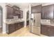Kitchen with stainless steel appliances, custom cabinetry, and granite countertops at 1518 Alligator St, St Cloud, FL 34771