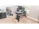 Bright home office features a standing desk, dual monitors, and ample natural light at 1518 Alligator St, St Cloud, FL 34771