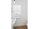Bathroom featuring modern sink, blinds, and a window to let in plenty of natural light at 2171 E South St # 5, Orlando, FL 32803