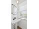 Bathroom featuring modern sink, mirror, and a window to let in plenty of natural light at 2171 E South St # 5, Orlando, FL 32803