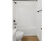 Bright bathroom featuring subway tile walls, a modern toilet, and a tub/shower combo with black fixtures at 2171 E South St # 5, Orlando, FL 32803