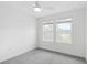 Bedroom with carpet, a ceiling fan, and plenty of natural light from two windows at 2171 E South St # 5, Orlando, FL 32803