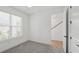 Bedroom featuring neutral carpet, ceiling fan and a large sunny window at 2171 E South St # 5, Orlando, FL 32803