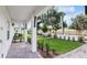 Inviting walkway leading to townhomes with lush green lawns and manicured landscaping at 2171 E South St # 5, Orlando, FL 32803