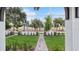View of the community's well-maintained green spaces and decorative stone accents at 2171 E South St # 5, Orlando, FL 32803