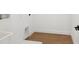 Bright laundry room with wood-look tile flooring and white cabinetry hookups at 2171 E South St # 5, Orlando, FL 32803