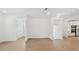 Bright living room featuring hardwood floors, neutral walls, and open floor plan to the stairs at 2171 E South St # 5, Orlando, FL 32803