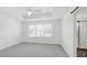 Spacious main bedroom featuring a tray ceiling, recessed lighting, and access to the ensuite bathroom at 2171 E South St # 5, Orlando, FL 32803