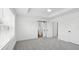 Bright main bedroom with neutral carpet, ceiling fan, and white trim at 2171 E South St # 5, Orlando, FL 32803