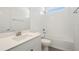 Bright bathroom with a white vanity, subway tiled shower and tub, and large mirror at 259 Severn Way # 38, Orlando, FL 32803