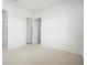 Bright bedroom featuring neutral carpet and two entry doors at 259 Severn Way # 38, Orlando, FL 32803