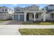 Charming two-story home featuring a covered entry, two-car garage, and well-maintained landscaping at 259 Severn Way # 38, Orlando, FL 32803