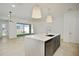 Kitchen island featuring a large sink, stainless steel appliances, and gray cabinets at 259 Severn Way # 38, Orlando, FL 32803